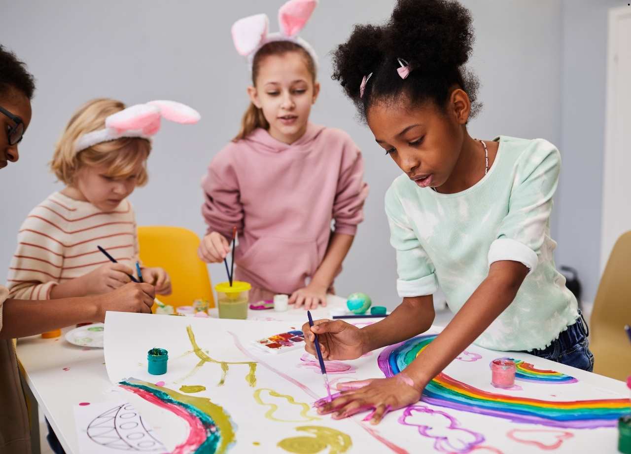children painting on white papers