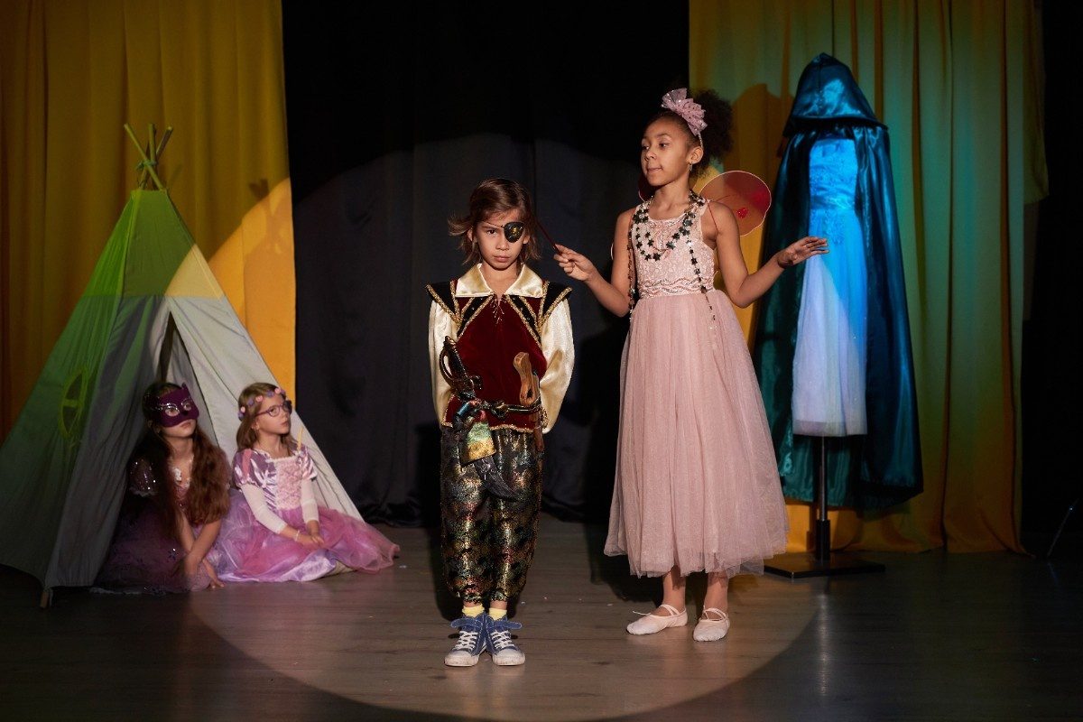 Boy and Girl Acting on Stage in School Play
