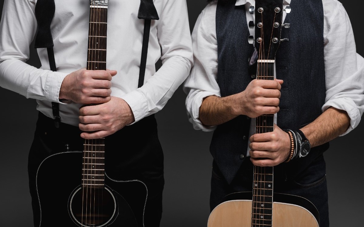 cropped-shot-of-duet-of-musicians-with-acoustic-guitars