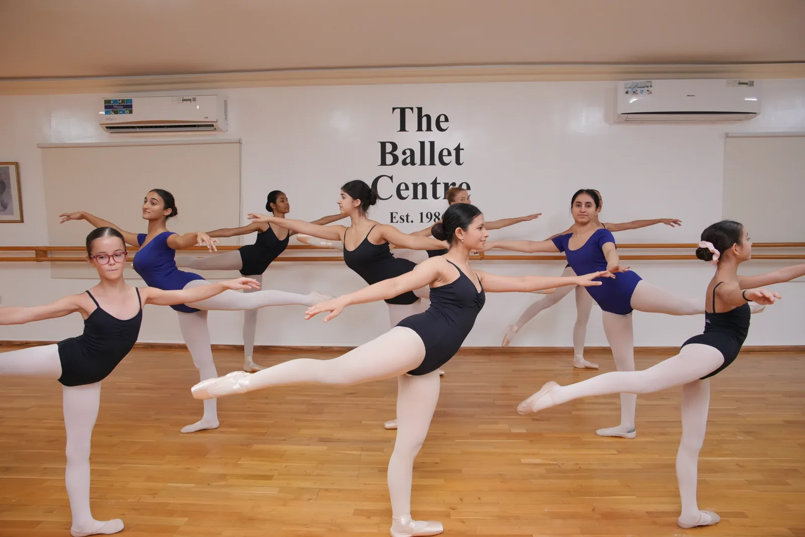 Arabesque across the studio
