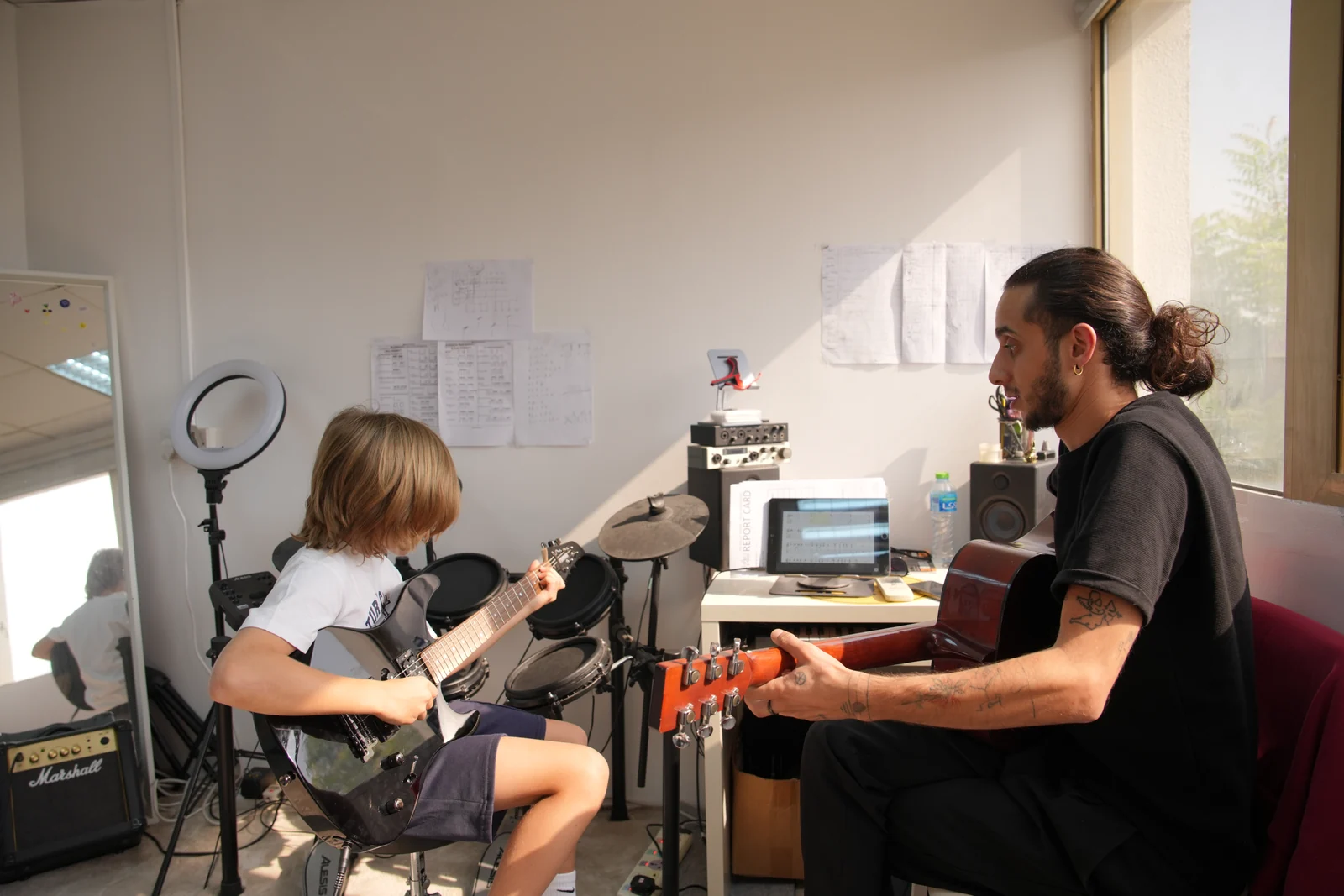 A guitar lesson at the centre