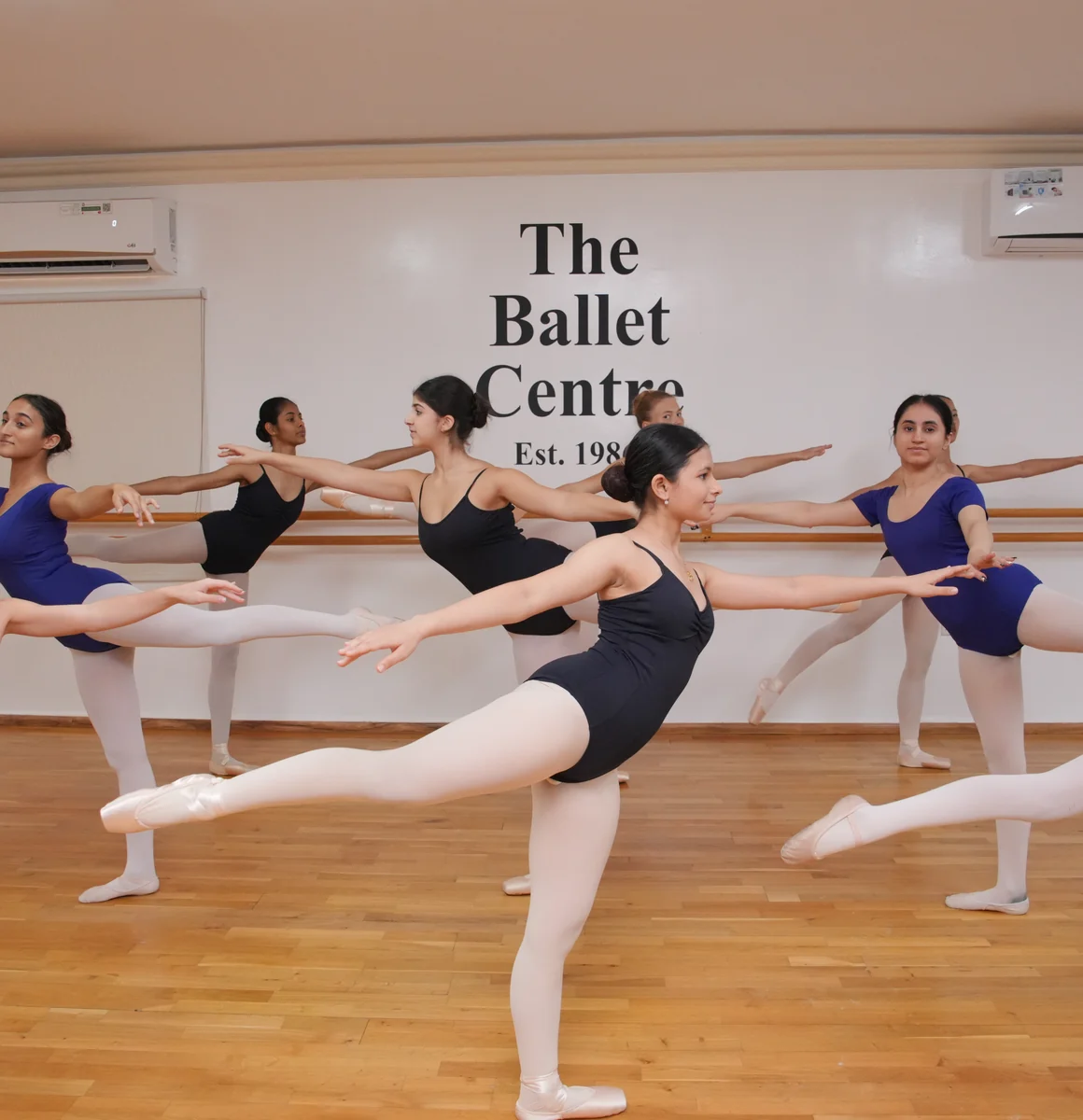 Ballet students lined up at the barre in a studio at the Jumeirah centre