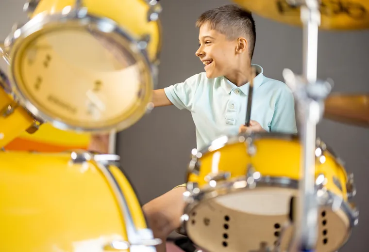 A student at the drum kit
