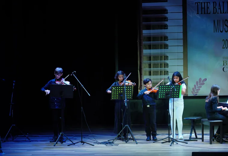 The ensemble performing on stage