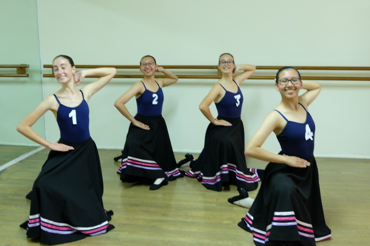Students in character skirts during a graded ballet class