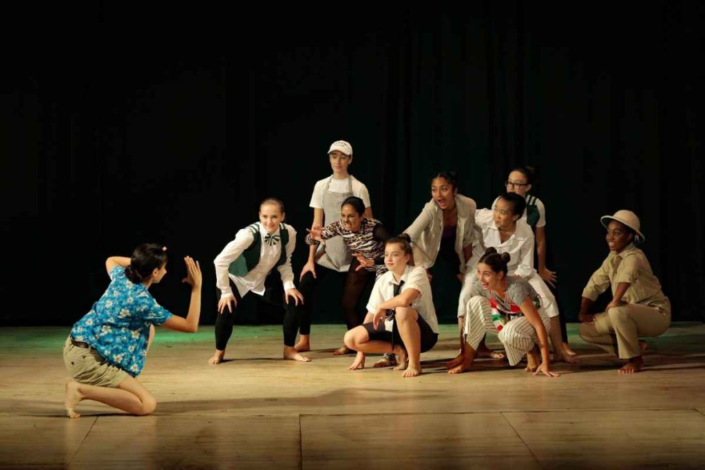 Kids posing while acting in pretend drama